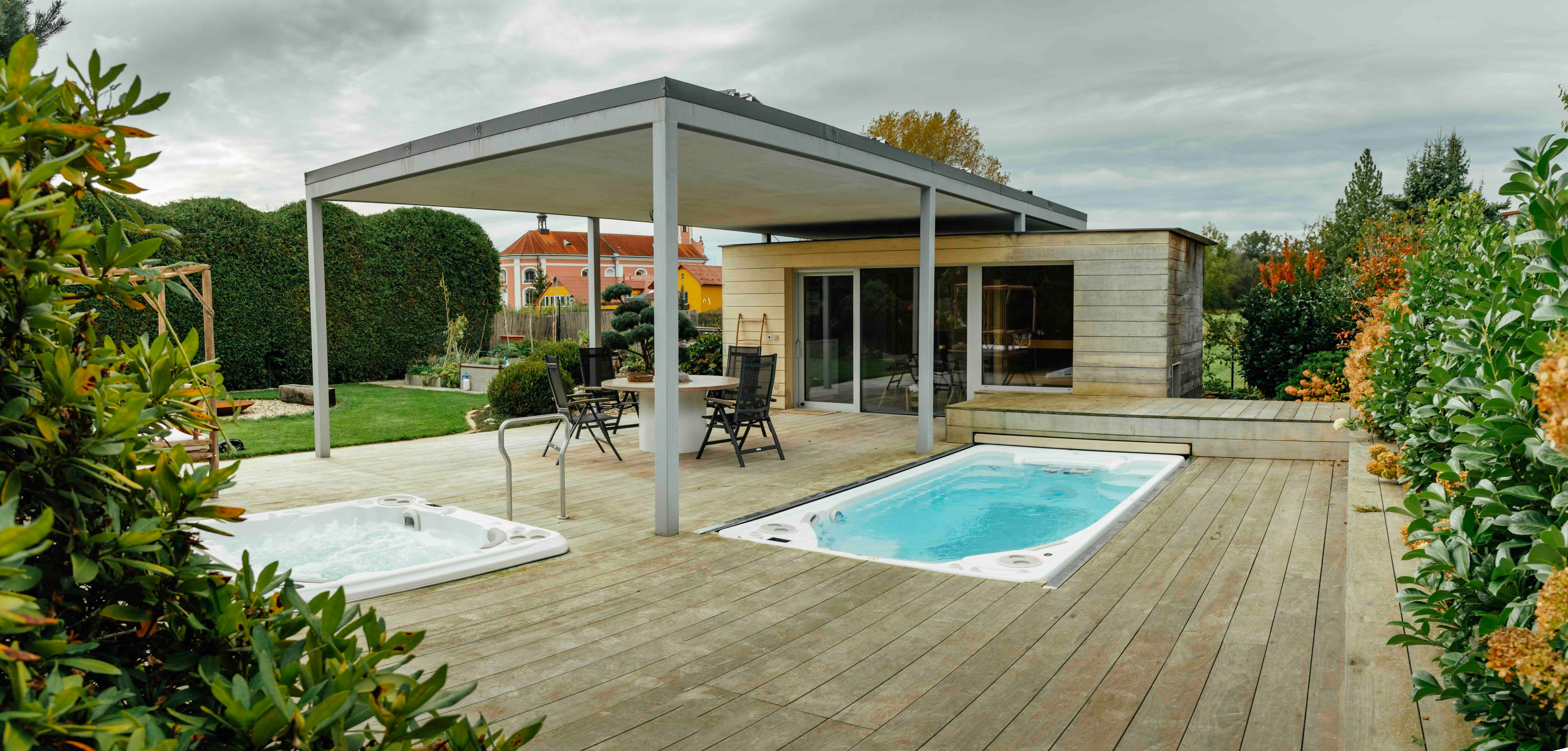 A below grade swim spa installation with hidden automated cover.
