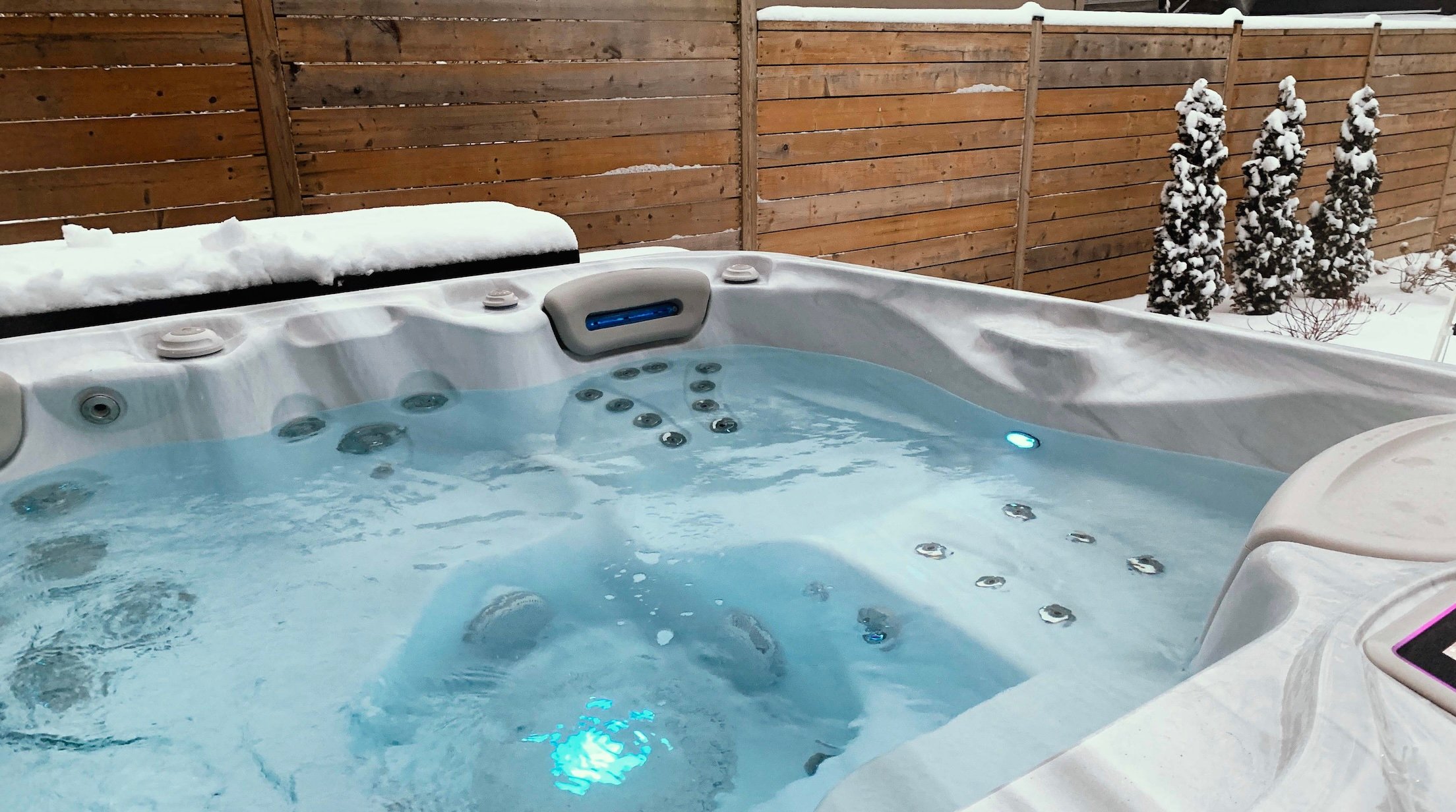 A clean and new Hydropool hot tub model with energy saving features.