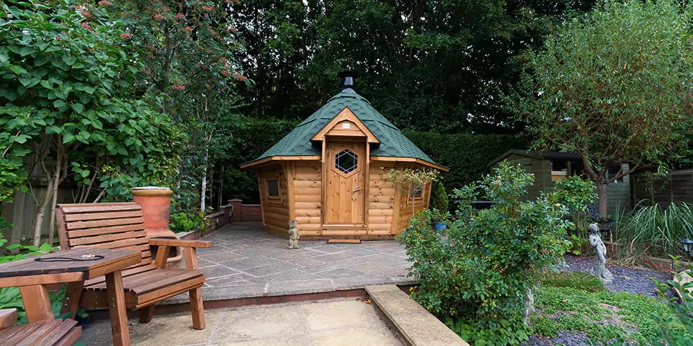 A unique sloped wall BBQ Cabin.