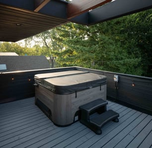 Hydropool North West hot tub with a well-maintained cover, showcasing proper protection after following essential care tips.