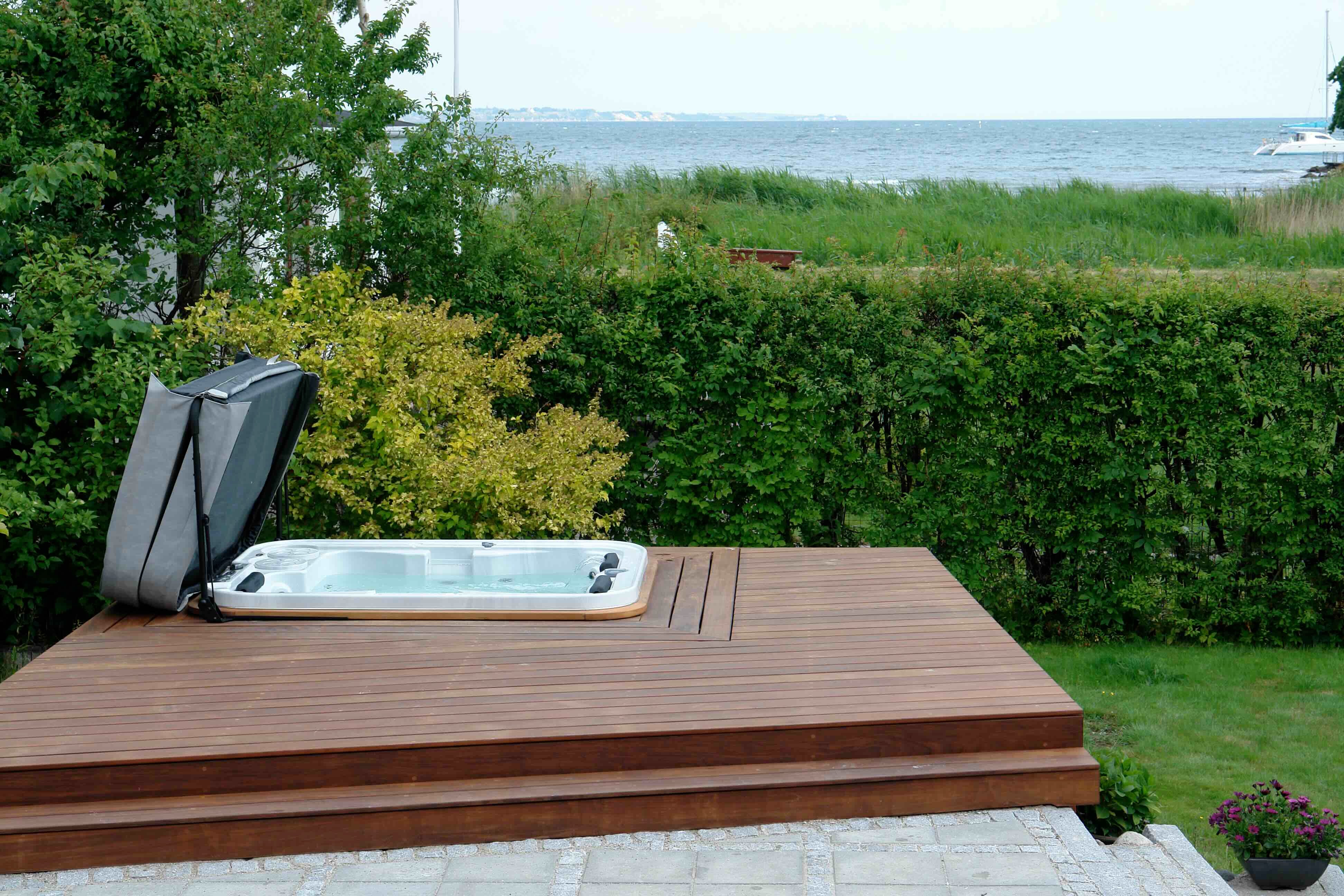 Well-kept hot tub cover from Hydropool North West effectively protecting a luxury hot tub, thanks to essential care.