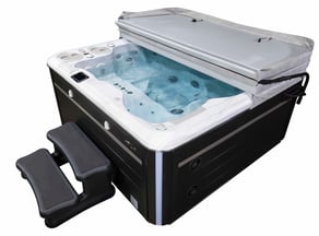 Properly protected luxury hot tub under its well-maintained cover, a result of essential care guidance from Hydropool North West.