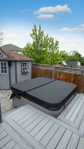 A luxury hot tub, perfectly covered and protected, illustrating the benefits of Hydropool North West's hot tub cover care tips.