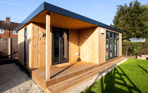 A versatile garden building being used as a guest room to extend the home.