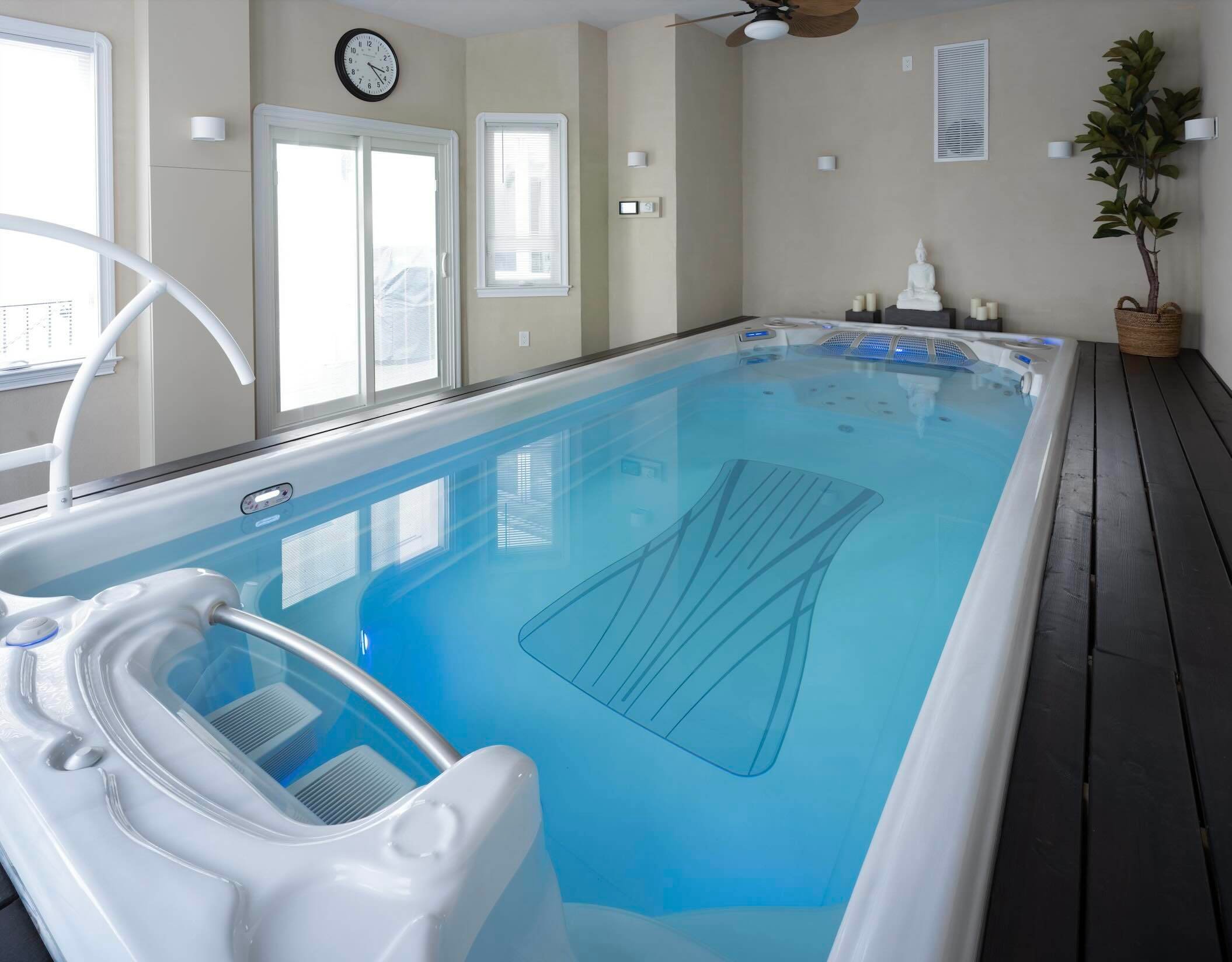 A swim spa in a residential development gym.
