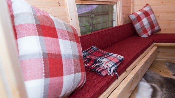 Comfy cushions in a BBQ Cabin.
