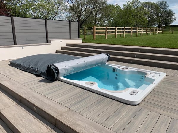 A Hydropool North West swim spa is the focus of an English garden near Manchester, set into decking.