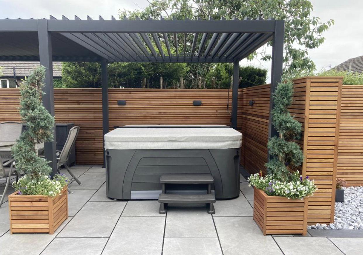 A luxury hot tub being correctly protected by its well-maintained hot tub cover after following essential hot tub cover care tips from Hydropool North West. 