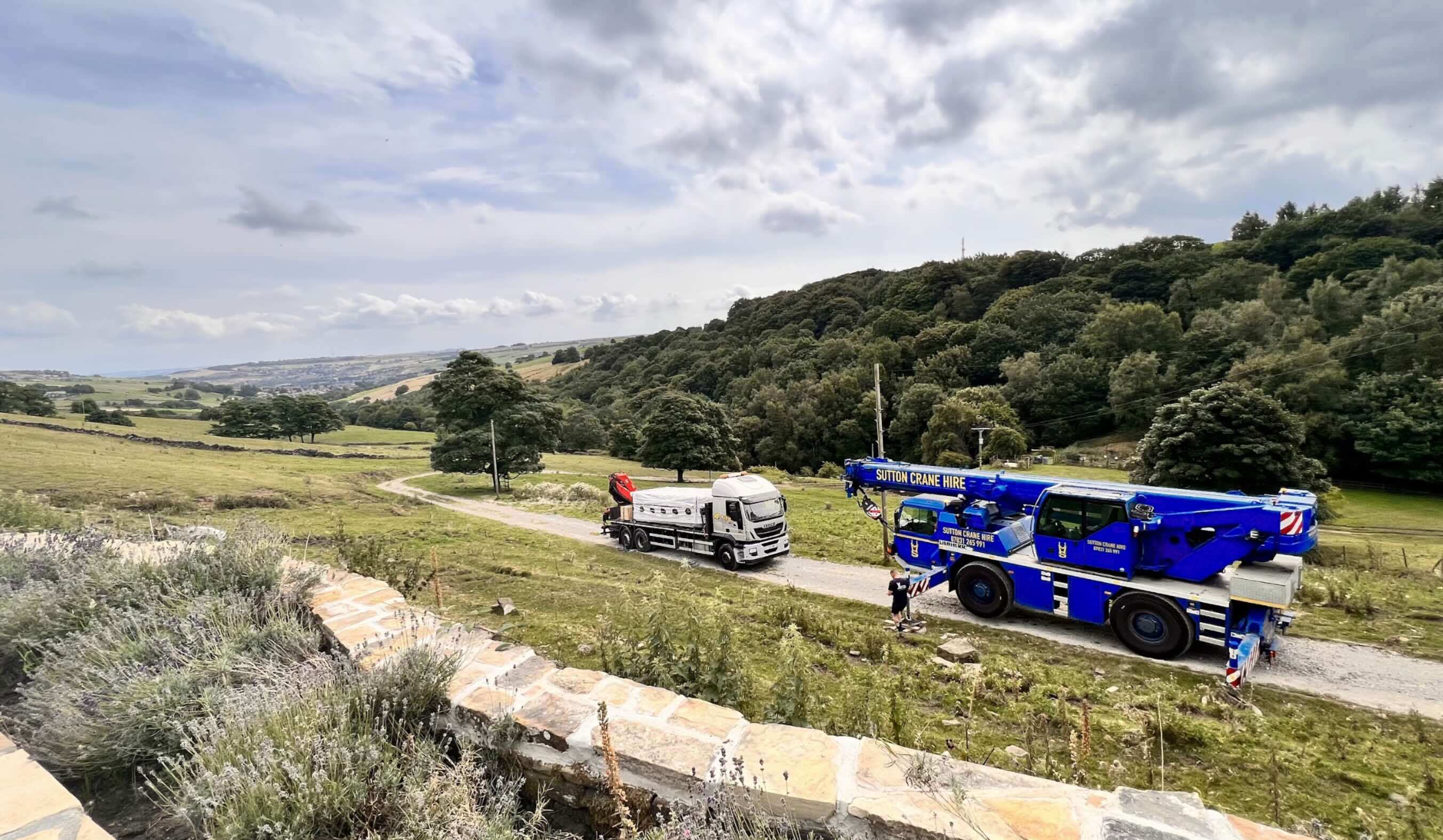 A delivery crane and lorry were parked up after delivering a swim spa, avoiding mistakes during installation. 