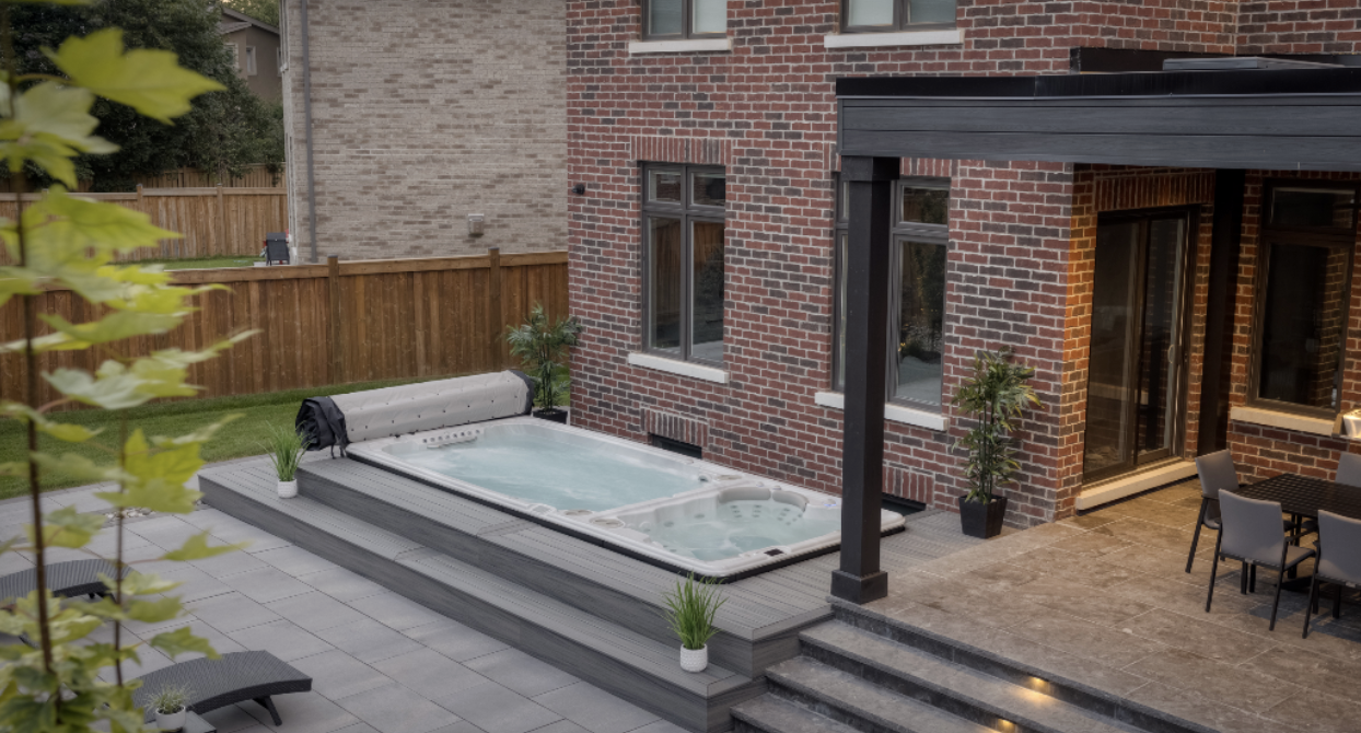 A swim spa and hot tub installed next to each other showcasing that swim spas are more practical for certain lifestyles. 