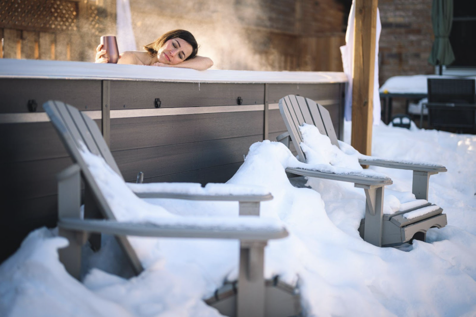 A woman relaxing in a hot tub for stress relief and anti-ageing benefits.