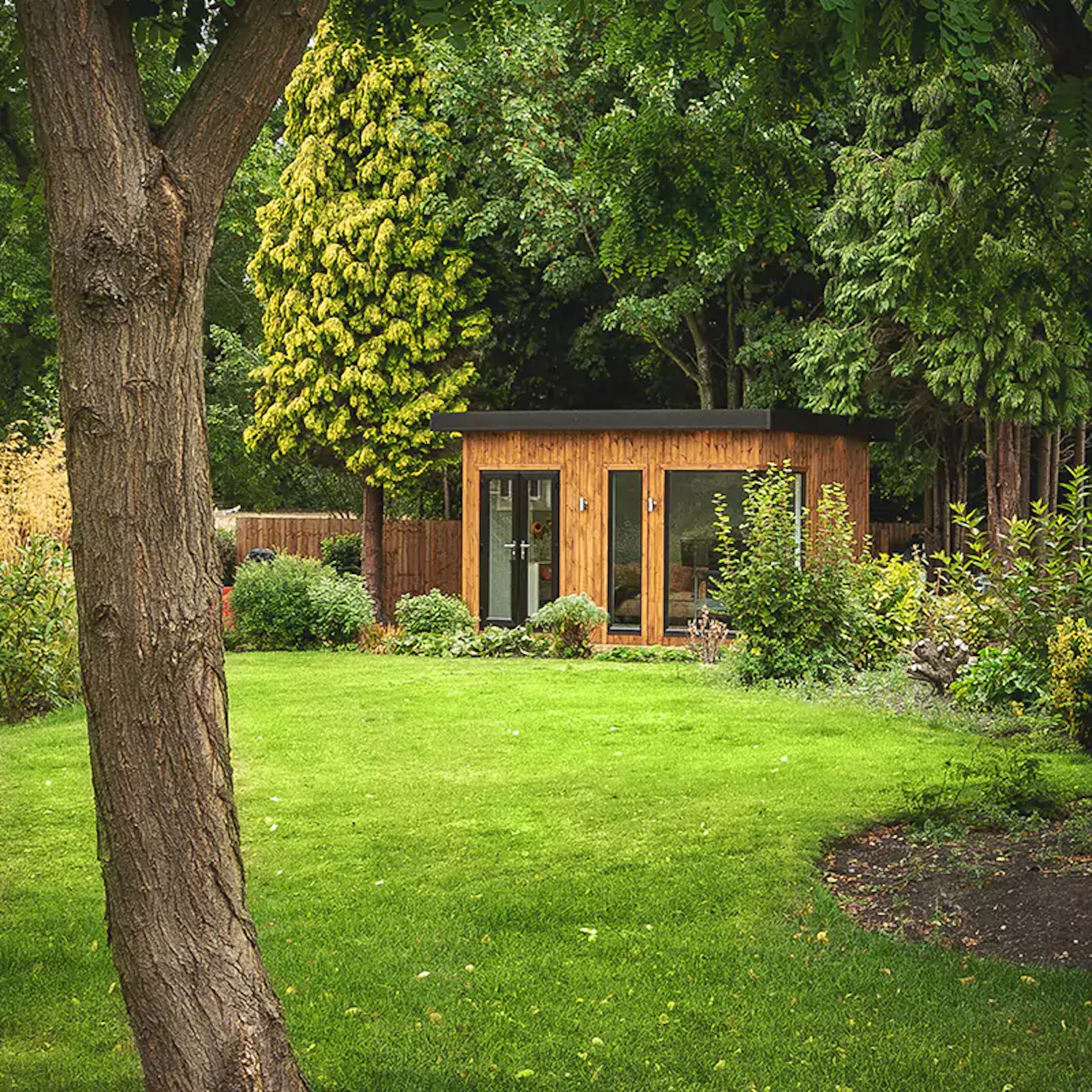 A unique garden building nestled into an English garden. 